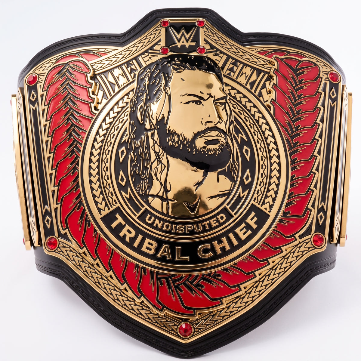 A WWE Undisputed Tribal Chief championship belt featuring a gold-toned central portrait of Chief, red feather-like wing panels, and black leather-like borders on a plain white background.