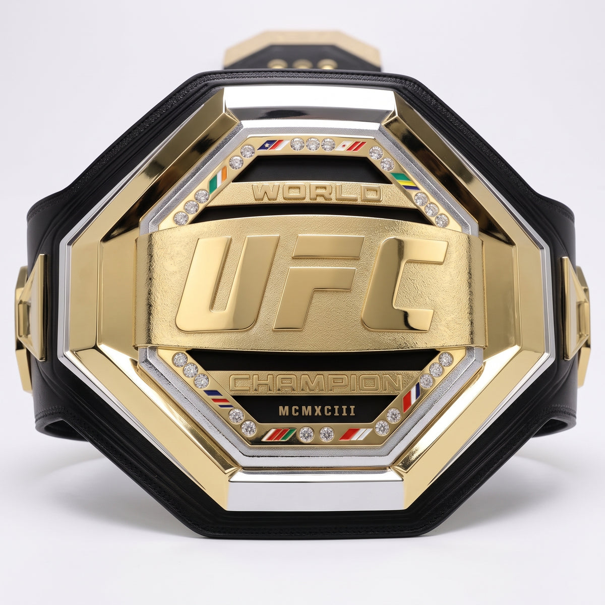 A gold and black octagonal UFC World Champion belt with crystal accents and a Roman numeral plate, photographed on a clean white background.