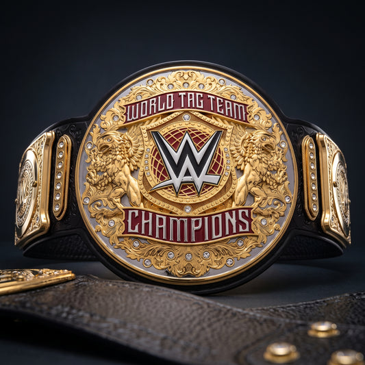 A close-up of a WWE World Tag Team Champions belt with a large round gold-toned medallion, red lettering, lion details, and a black strap, photographed against a dark studio background.