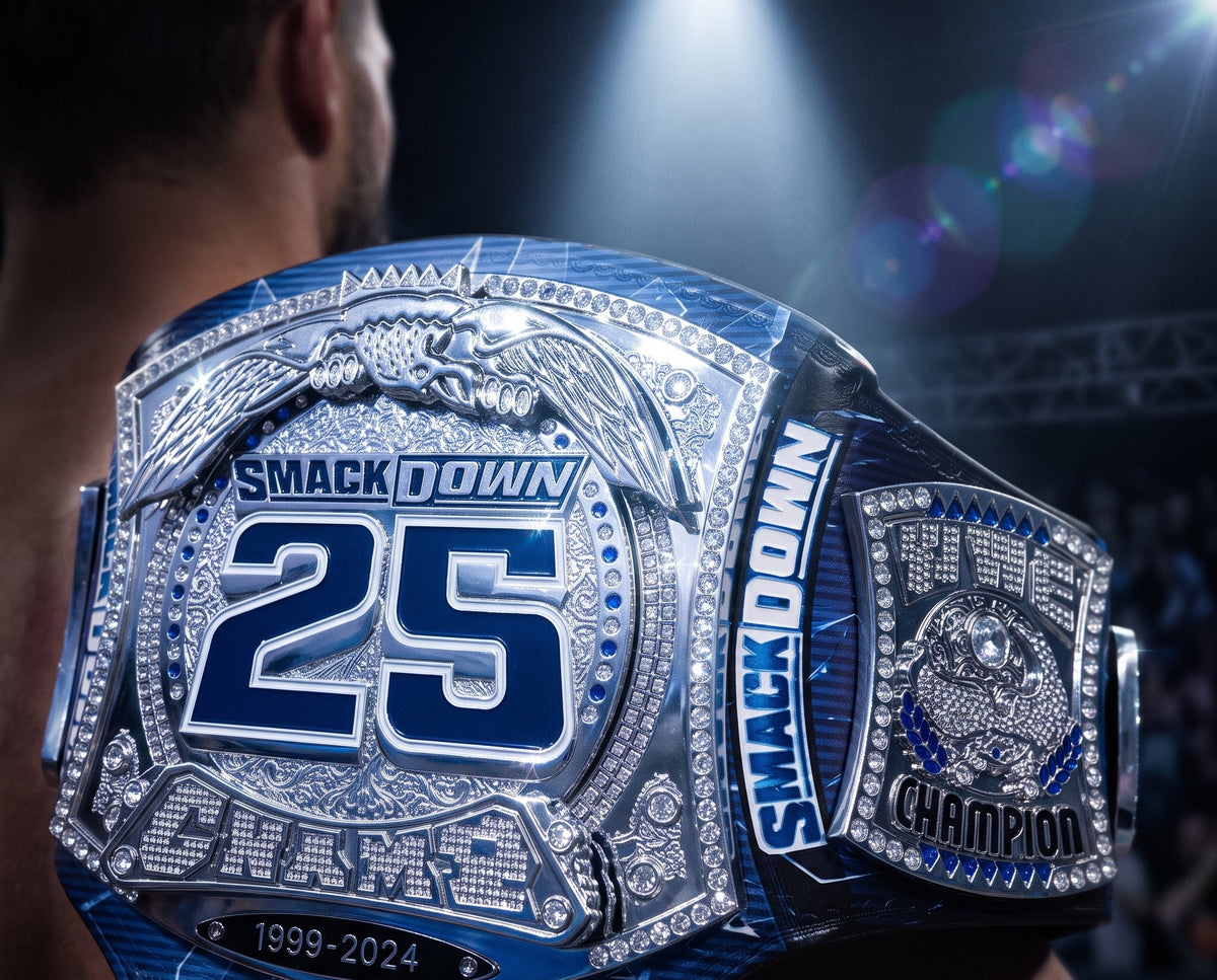 A close-up of a person wearing a large blue and silver WWE Smackdown 25 Anniversary Championship belt, with the back of their head and shoulders visible against a dark, spotlight-lit arena background.